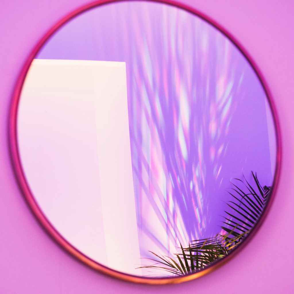 oval brown framed mirror